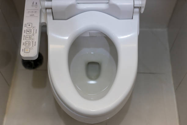 istock Electronic control panel of toilet sanitary ware with automatic flush system. toilet with electronic seat automatic flush, japan style toilet bowl, high technology sanitary ware. 1266430376