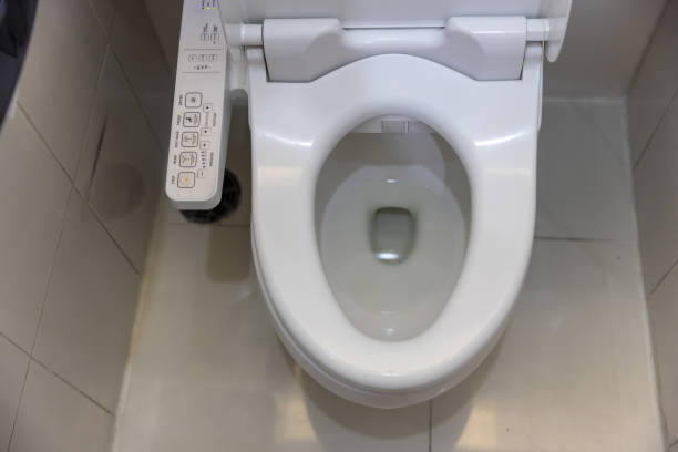 istock Electronic control panel of toilet sanitary ware with automatic flush system. toilet with electronic seat automatic flush, japan style toilet bowl, high technology sanitary ware. 1266430377