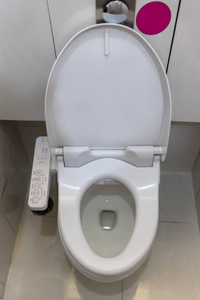 istock Electronic control panel of toilet sanitary ware with automatic flush system. toilet with electronic seat automatic flush, japan style toilet bowl, high technology sanitary ware. 1266430382