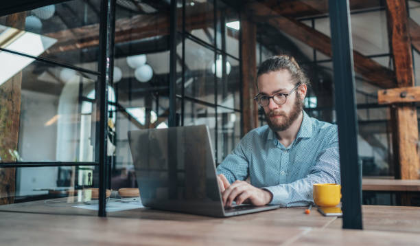 istock Young businessman working at office 1266431395