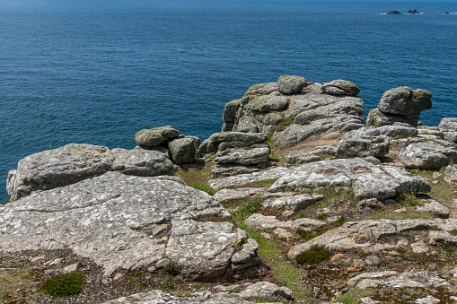 View from the Land's end peninsular, the most westerly point on the English mainland. This shows the off the coast. It has a dangerous cliffs sign on the foreground.