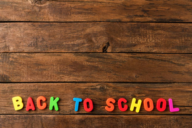 istock Back to school. Colourful text on retro wooden background with copyspace 1266434048