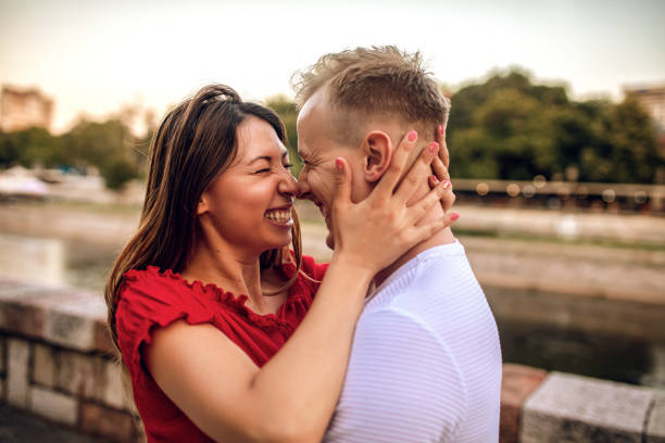 istock Cute loving couple hugging and kissing 1266436096