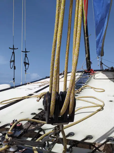 Close up of catamaran ropes. Nautical boat pattern. The trampoline is placed along the inside of the rafters and tensioned with a rope or shock cord.