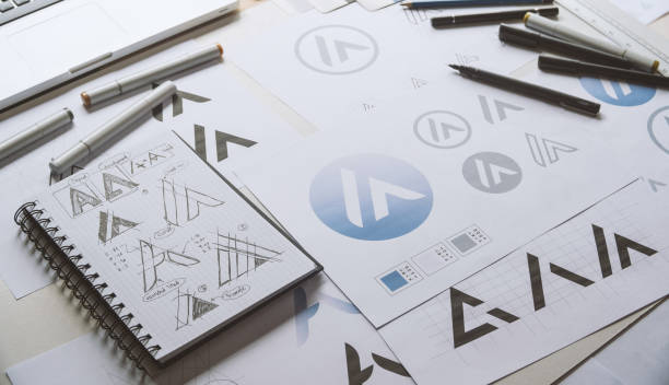 istock Graphic designer creative design sketch drawing logo Trademark brand Workspace 1266436335