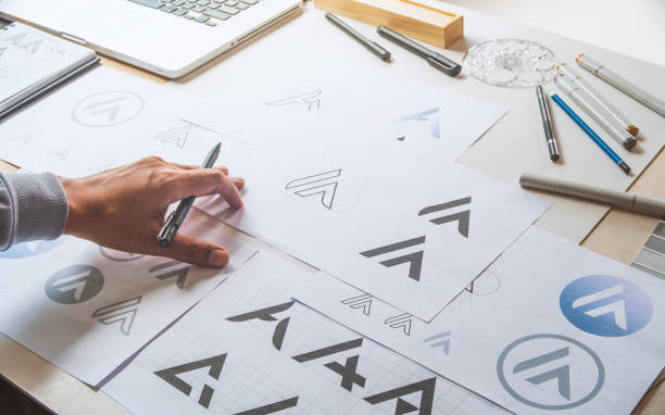 istock Graphic designer creative design sketch drawing logo Trademark brand Workspace 1266436344