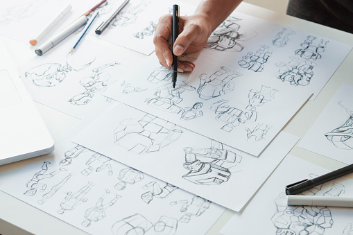 Animator designer Developmenting drawing drawing sketching development creating graphic pose characters sci-fi robot Cartoon illustration animation video film production, animation design studio. photo