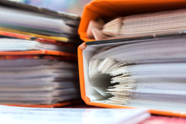 istock File document orange binders for accountant audit in bookkeeping business office. Archive auditing or financial in corporate concept 1266437297
