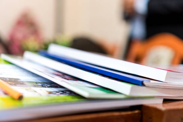 istock Education book report in school, Class documents of Binders file Paperwork Document on teacher desk office, Annual Reports document for education evaluation in student study in school 1266437299