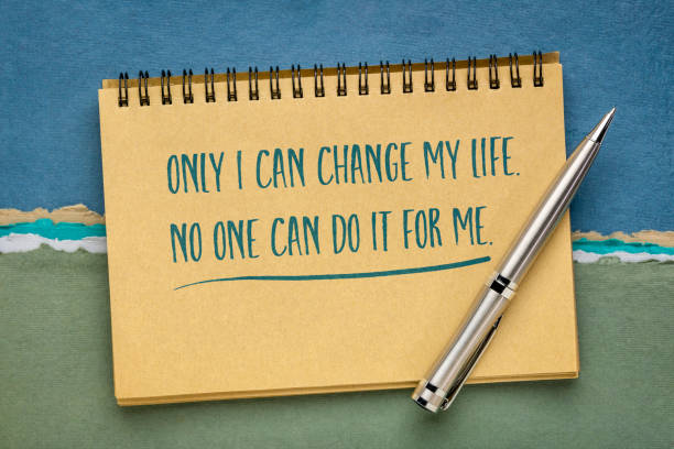 istock only I can change my life - inspirational note in sketchbook 1266439783