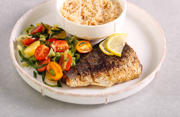 istock Fried sea bass fish fillet served 1266443774