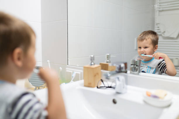 istock Adorable child brushing his teeth 1266444287