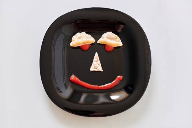 istock Food face, funny dumpling and ketchup 1266446122