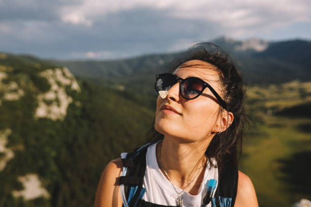istock Holding a butterfly on the mountain peak 1266449621