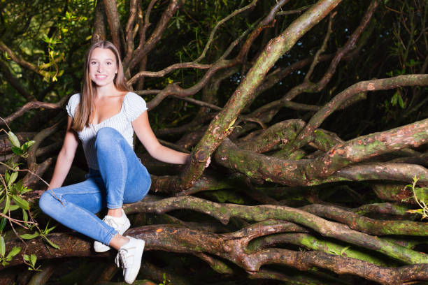 istock Young lady climbing in the woods 1266449895