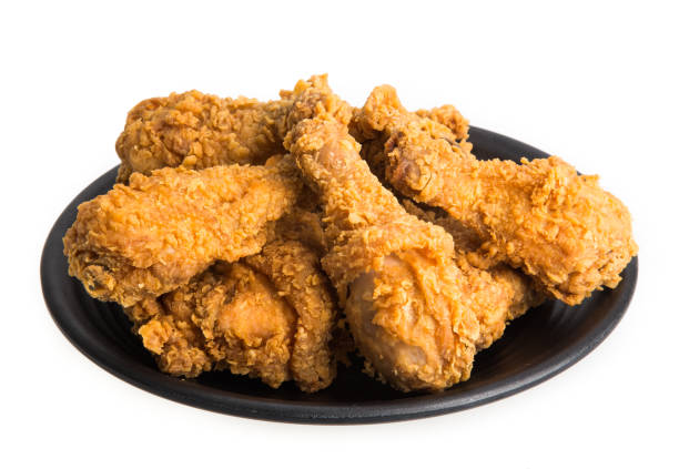 istock plate of fried chicken isolated on white background 1266451079