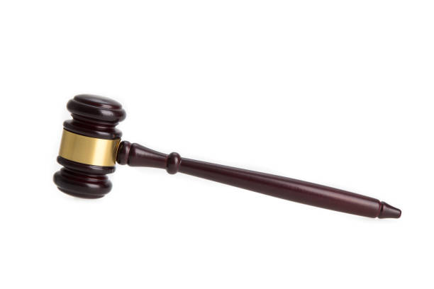 istock a brown gavel isolated on white background 1266451125