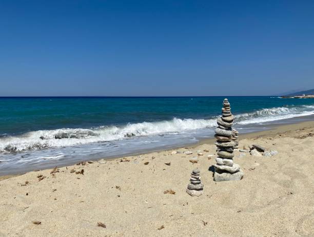 Stone tower on the beach stock photo