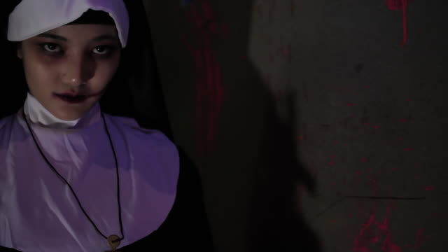 Horror nun Screaming to camera in Halloween event