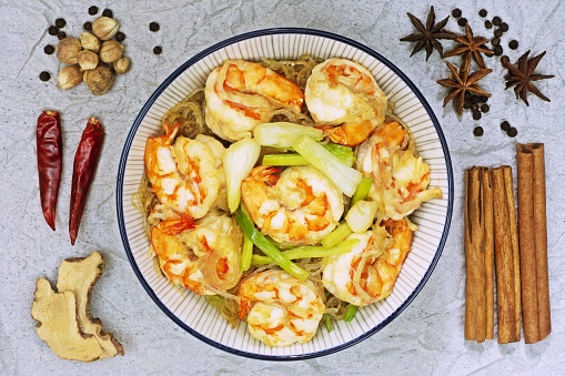 Baked Shrimps with vermicelli , Thai food - Herb background.