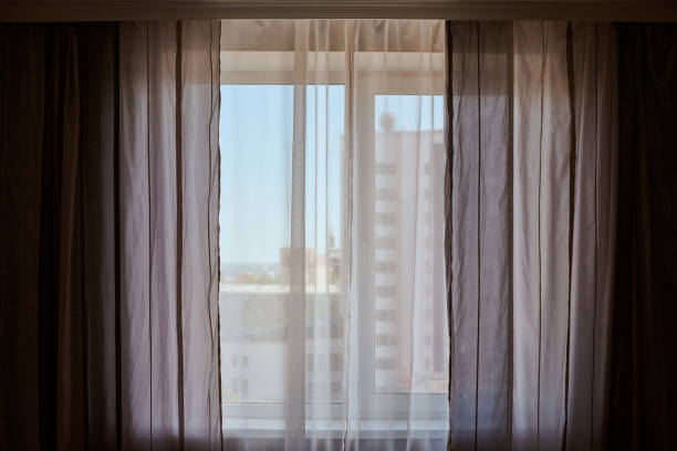 istock Windows with curtains in rental apartment. 1266460161