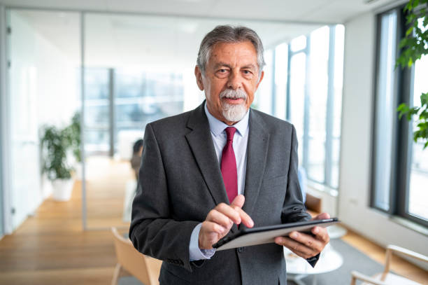 istock Portrait of Senior Businessman Using Digital Tablet 1266460794