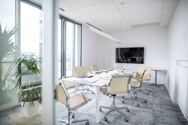 Modern conference room with large blank screen display for video conferencing