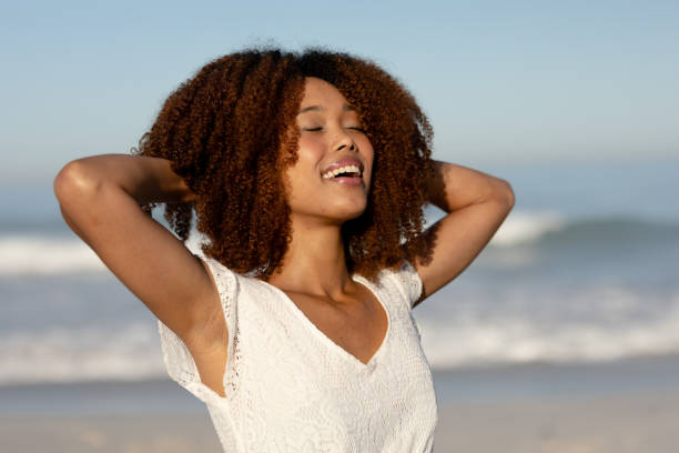 istock Mixed race woman enjoying her time on the beach 1266467626