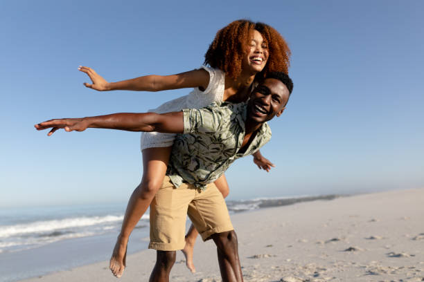 istock Happy couple spending time together on the beach 1266467705