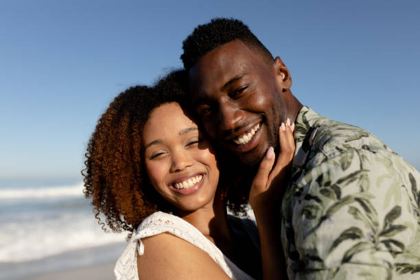 istock Happy couple spending time together on the beach 1266467863