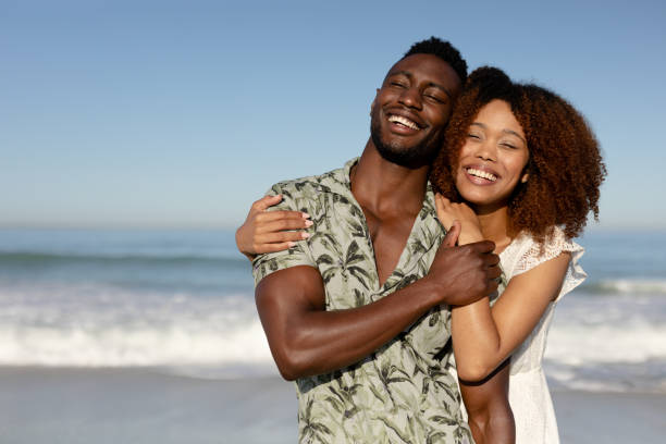 istock Happy couple spending time together on the beach 1266467911