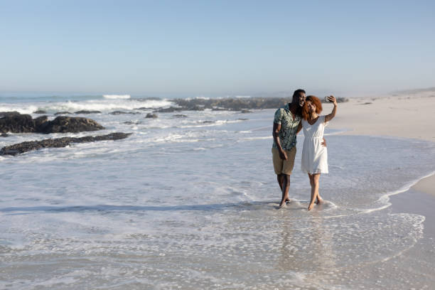istock Happy couple spending time together on the beach 1266468639