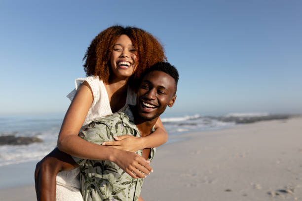istock Happy couple spending time together on the beach 1266468764