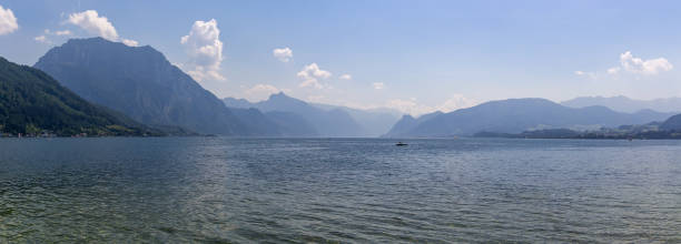 istock Panoramic view to Traunsee lake with alps mountain. Summer Austria landscape 1266472859