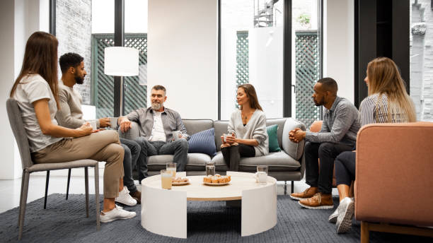 istock Group of business people in office cafeteria 1266475744