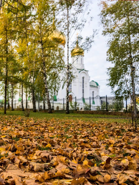 istock Fallen leaves and church 1266476584