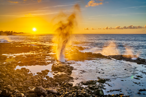 Spouting Horn blow hole at sunrise on the Island of Kauai