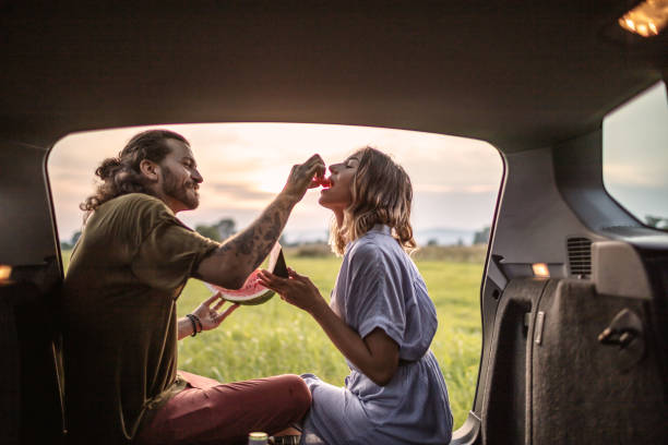 istock A young man feeds a young woman with watermelon 1266480923