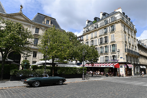 Paris, France-08 15 2020:A Classical English car parked on the Saint-Germain-des-Pres quarter in Paris, France.