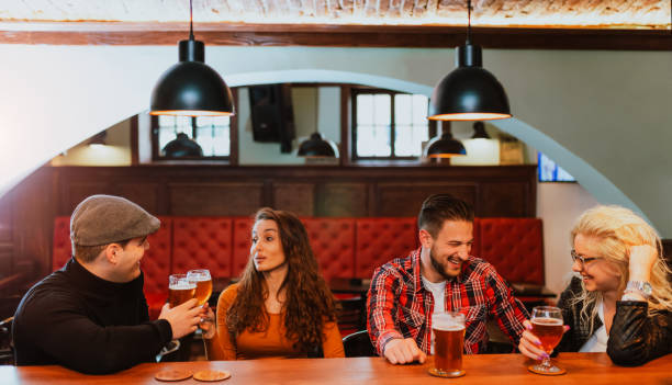 istock Cheers celebration toast with pints of beer 1266481405
