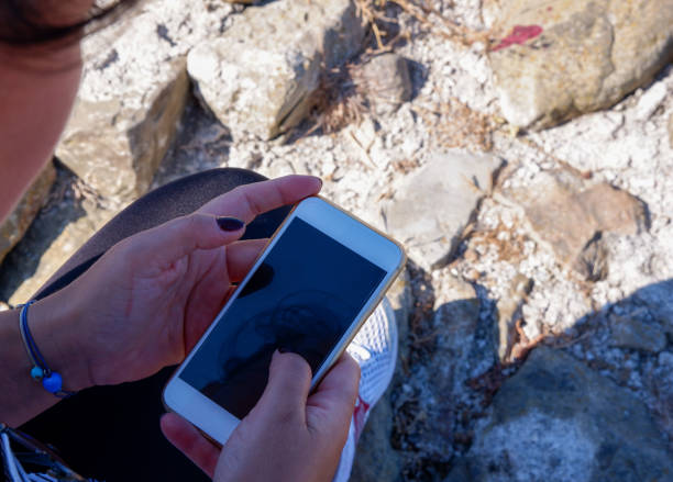 istock Woman touching and browsing her smart phone. 1266485363