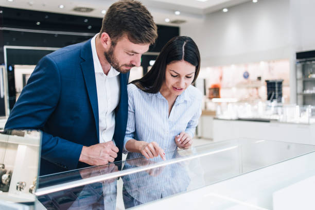 istock Middle age couple in jewelry store 1266487237
