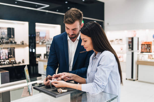 istock Middle age couple in jewelry store 1266487248