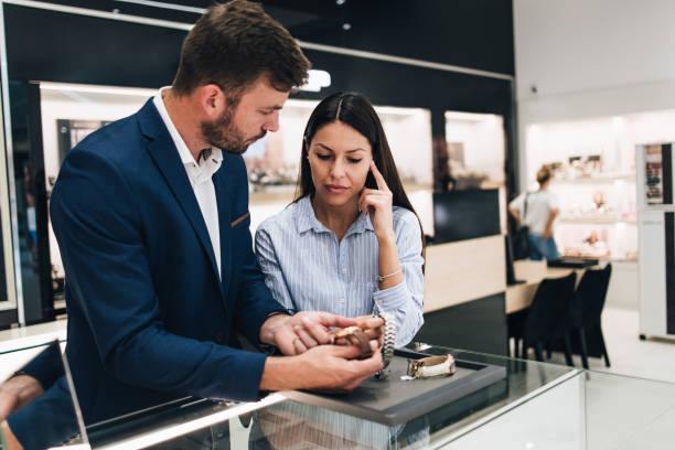 istock Middle age couple in jewelry store 1266487249