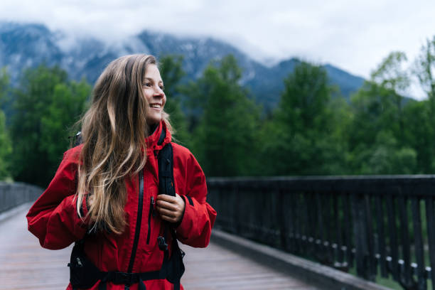 Its raining and there are mountains and lofty clouds distant