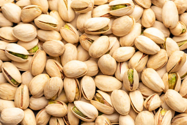 istock Isolated pistachios on white background. 1266492875