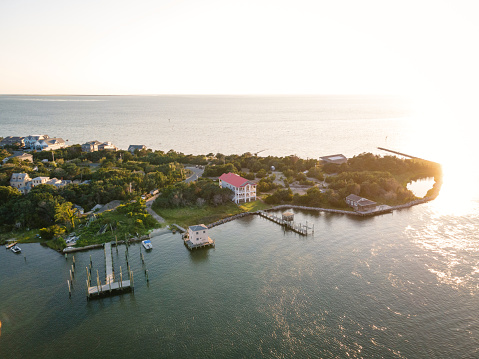 Aerial view of Silver Lake harbor and Ocracoke village on Ocracoke Island, North Carolina at golden hour.