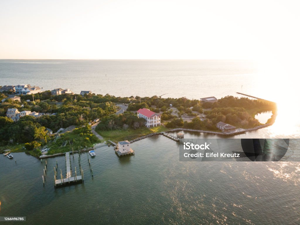 Aerial View of Village on Ocracoke Island, North Carolina Aerial view of Silver Lake harbor and Ocracoke village on Ocracoke Island, North Carolina at golden hour. Ocracoke Island Stock Photo