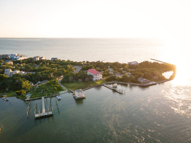 Aerial View of Village on Ocracoke Island, North Carolina Aerial view of Silver Lake harbor and Ocracoke village on Ocracoke Island, North Carolina at golden hour. ocracoke island stock pictures, royalty-free photos & images