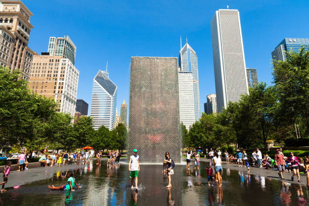 Chicago, Illinois USA - August 21, 2011: Visitors enjoying the popular Crown Fountain in Millennium Park in the downtown district on a hot summer day.
